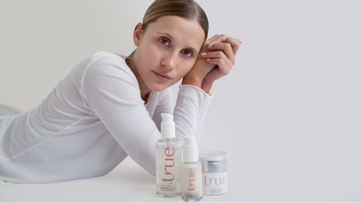 TrueDerm skincare on a cream background